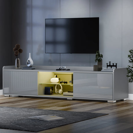 Modern living room with a gray TV stand, television, and decorative items.