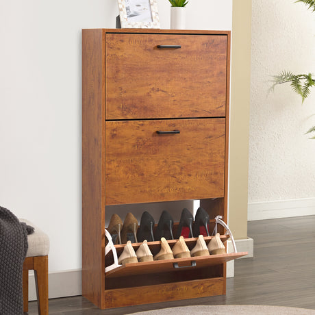 Oak shoe cabinet in a 3 tier shoe cabinet style, with decorative items placed on top and footwear in the lower drawer.