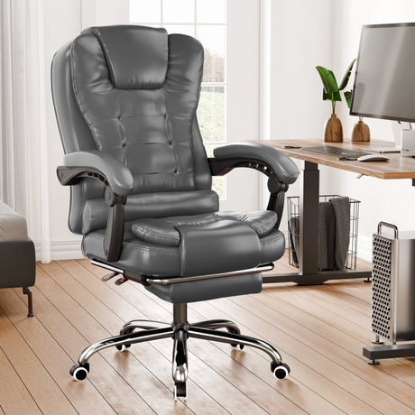 Gray office chair in a home office setting with a desk and computer.