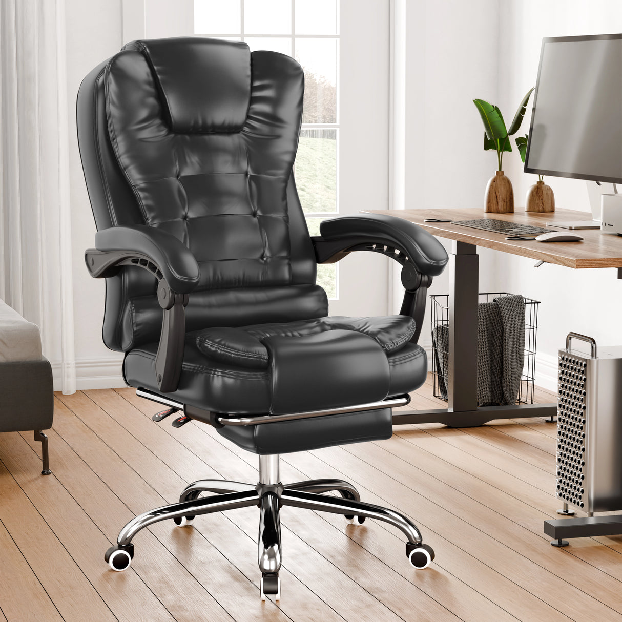Black office chair in a home office setting with a desk and computer.