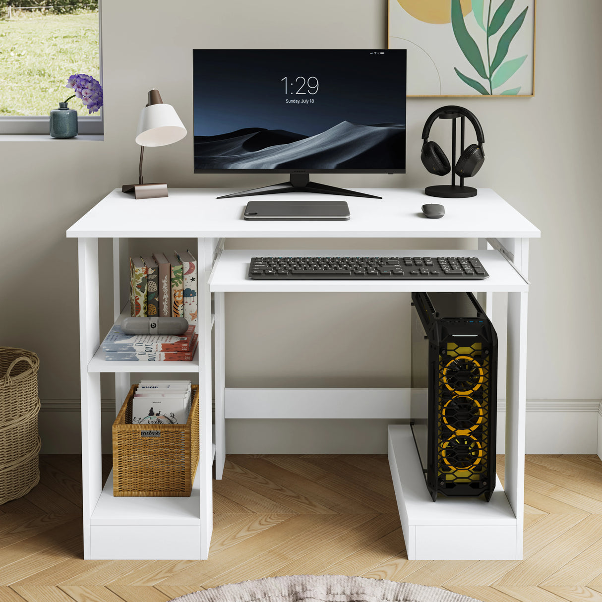 White desk with computer setup including monitor, keyboard, and tower in a room with a window and plant.
