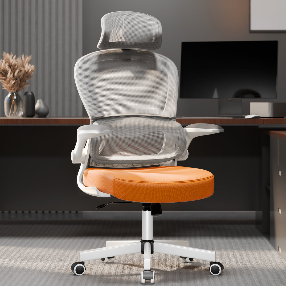 Ergonomic computer chair with orange cushion and mesh back in a modern home office setup. Designed for lumbar support and long hours of desk work.