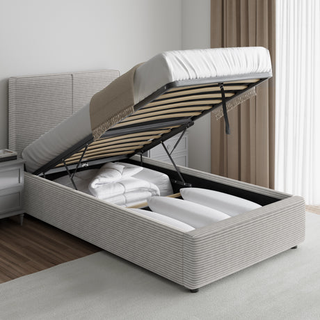 Corduroy ribbed velvet upholstered ottoman bed frame with end lift storage in light grey, shown open with bedding stored inside. Ideal for modern bedrooms.