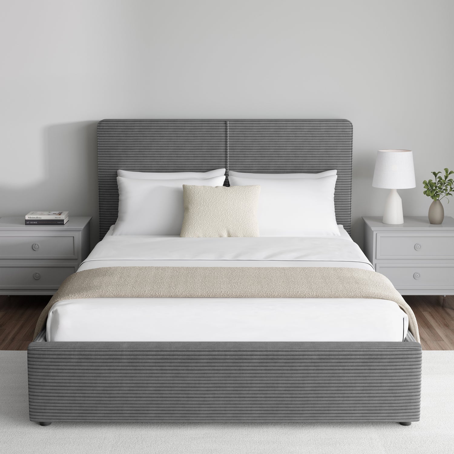 Corduroy ribbed velvet upholstered ottoman bed frame with storage in dark grey, shown in a modern bedroom with matching grey nightstands. Features a lift-up storage base and padded headboard.