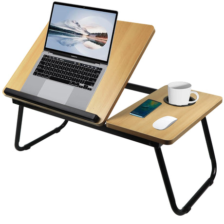 pine wood laptop table with lifted top holding a laptop and cup, designed for use on beds or sofas