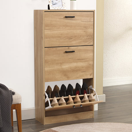 Pine shoe cabinet with a 3 tier shoe cabinet structure, in a hallway with footwear in the lower compartment.
