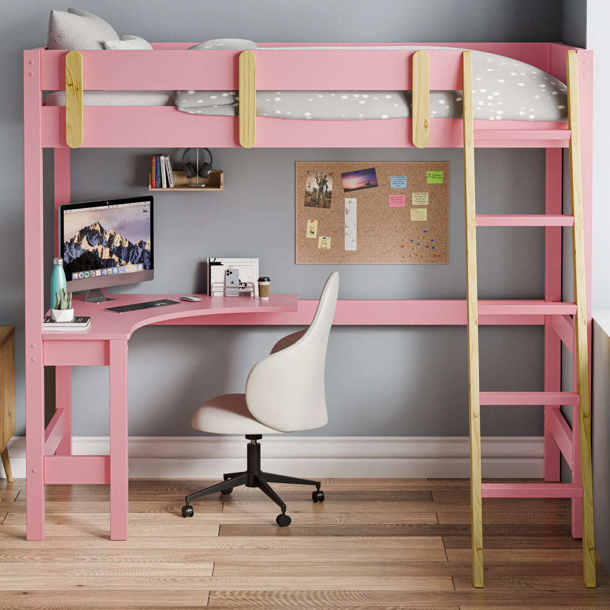 Front view of modern pink bunk bed with a built-in desk underneath, placed against a wall