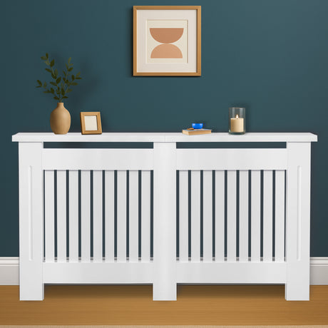 White radiator cover with decorative items against a blue wall