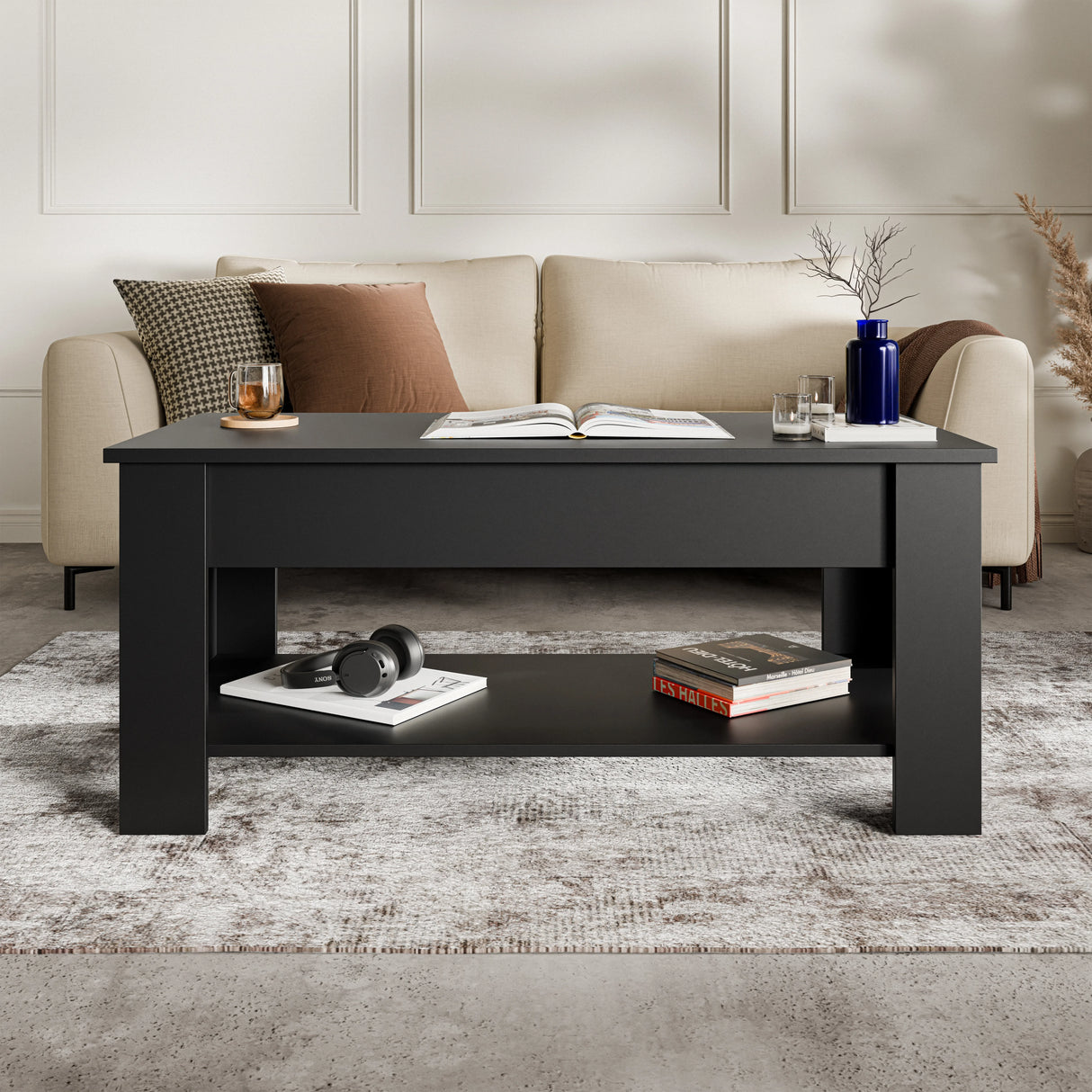 Modern black lift top coffee table with storage shelf, 100cm wide, placed in a stylish living room with beige sofa and neutral decor.