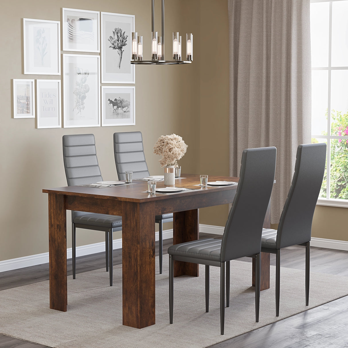 Dining room with wooden table and gray chairs, framed pictures on the wall.
