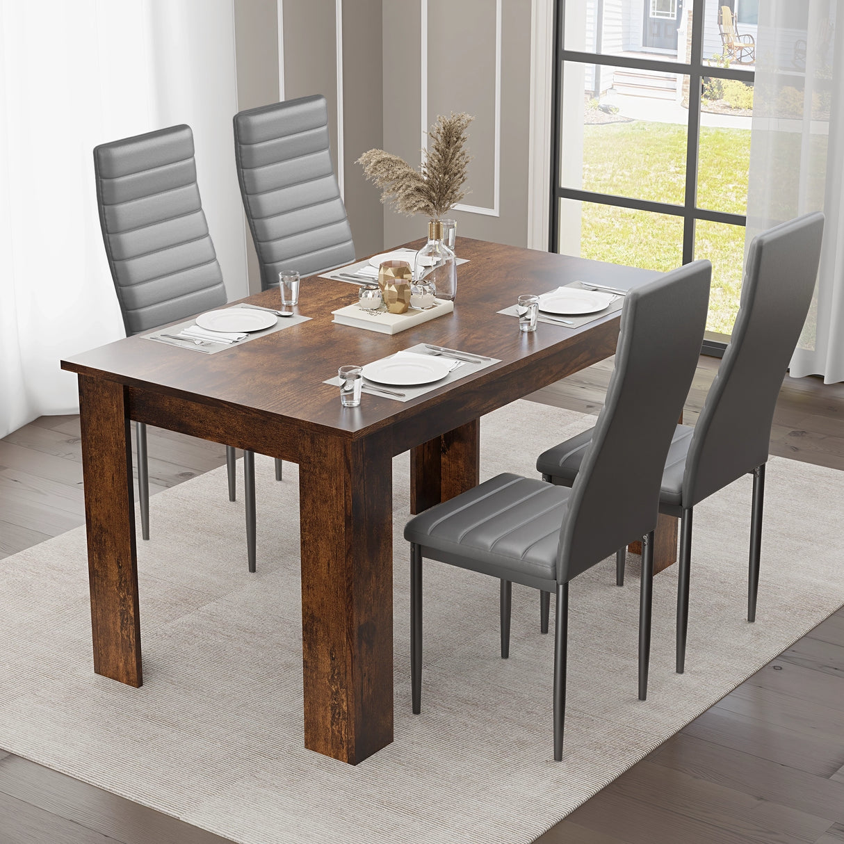 minimal dining room tables sets layout with grey leather chairs and a rustic wood table, styled with pampas centerpiece