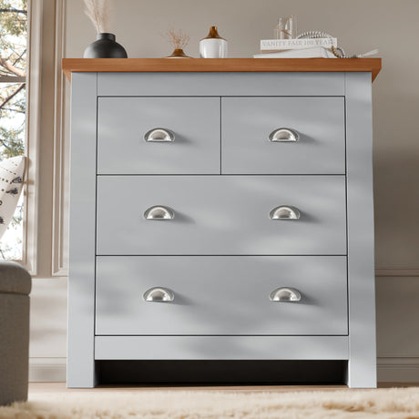 2 over 2 Chest of Drawers Bedroom | Chester Drawers in light grey with oak top, featuring 4 spacious drawers and silver cup handles for modern storage.