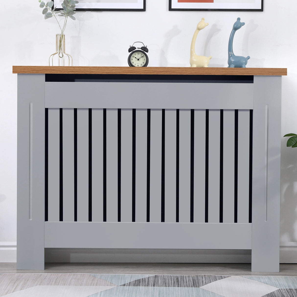 Front view of radiator cover grey with oak top in a warm living room setting, offering both elegance and practicality.