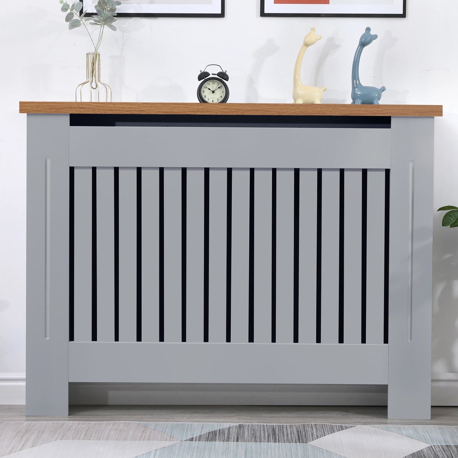 Front view of radiator cover grey with oak top in a warm living room setting, offering both elegance and practicality.