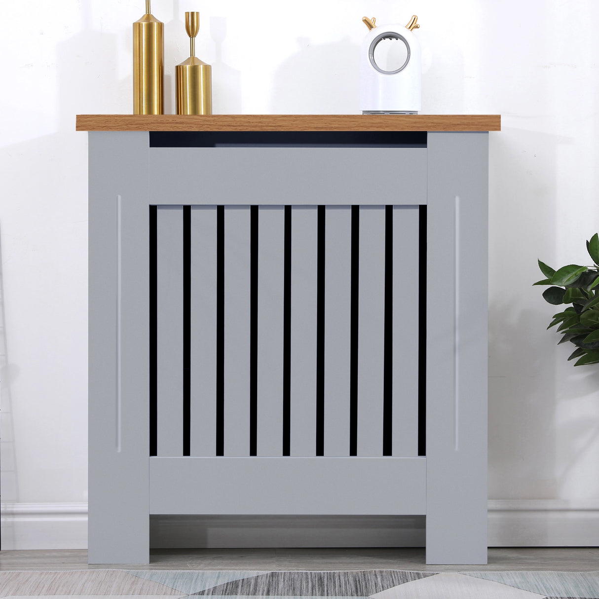 Front view of small radiator covers in grey with oak top, perfect for compact hallway or entryway spaces.