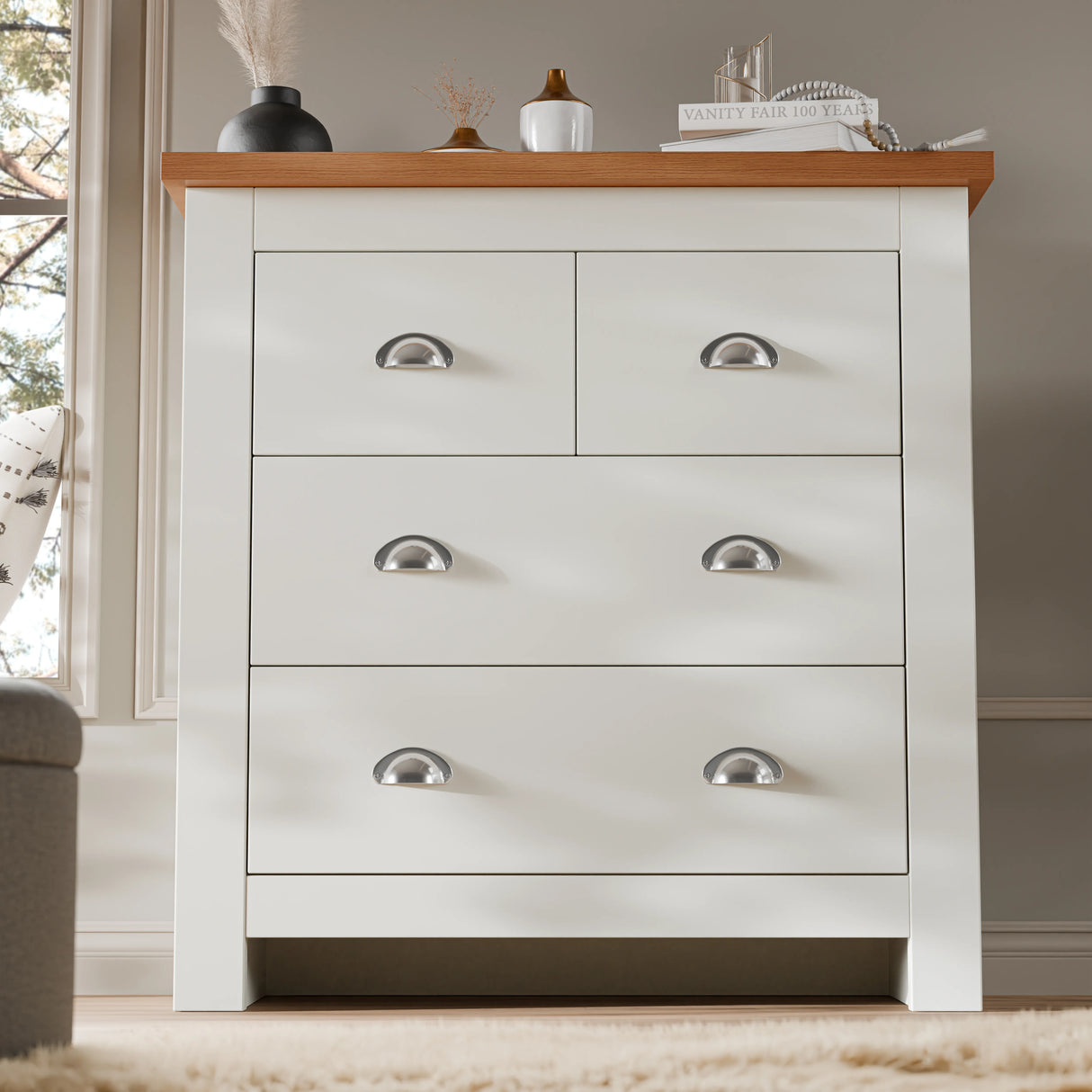 2 over 2 Chest of Drawers with white finish and oak top, featuring four drawers and chrome cup handles. Ideal for compact bedroom storage.