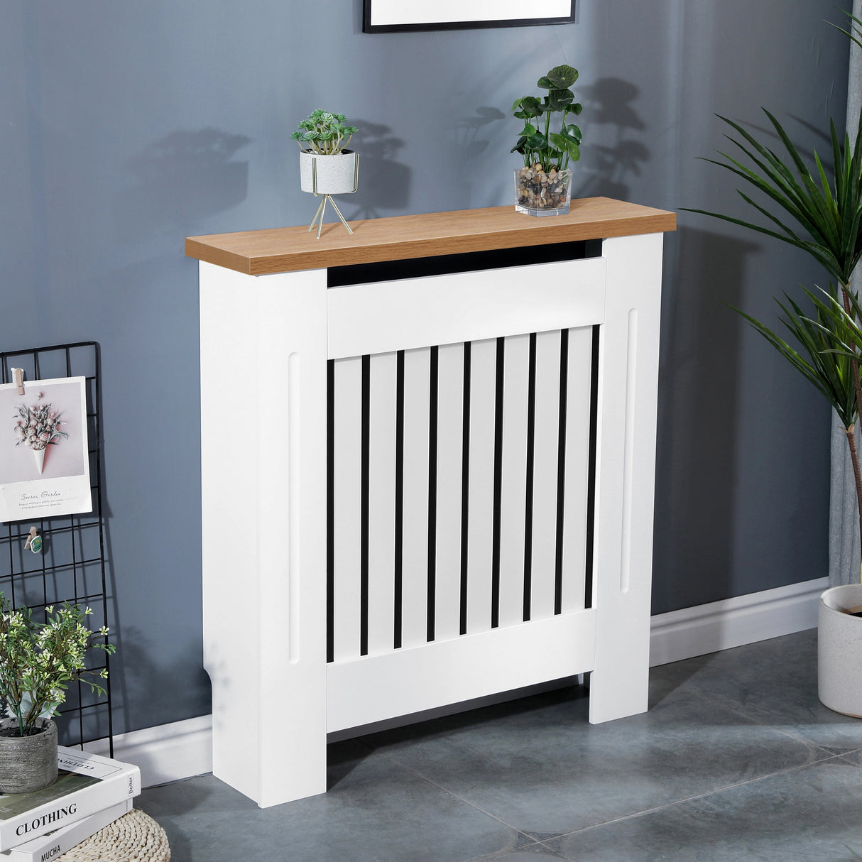 Low radiator cover in white with oak top shown at a tilted front angle in a modern living room setting.