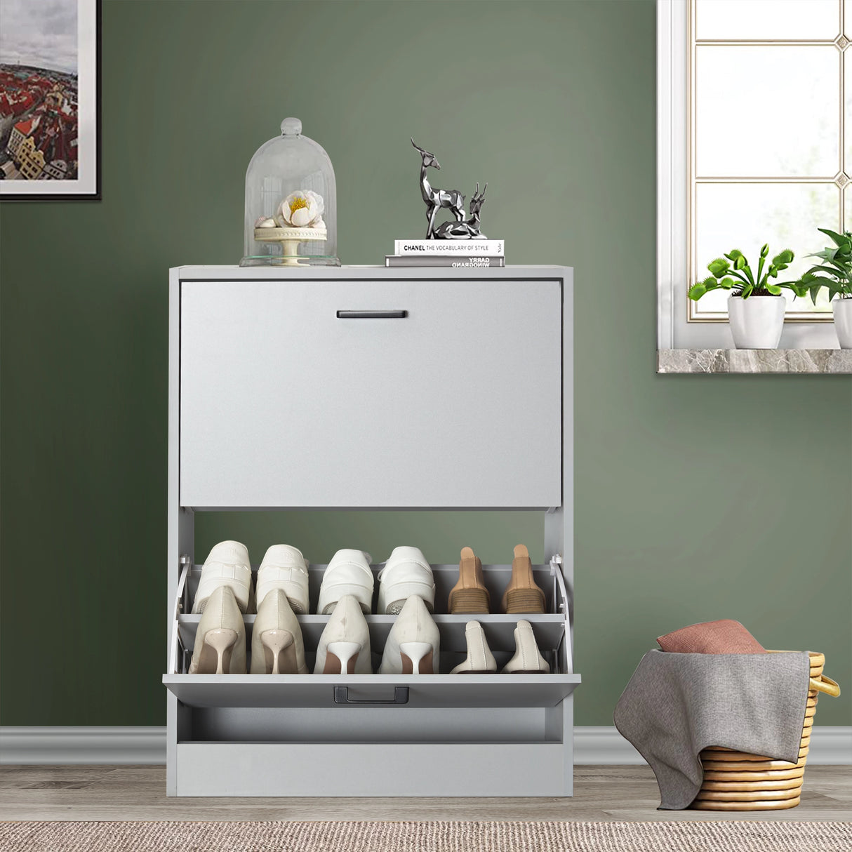 Light grey 12 pair shoe storage cabinet featuring a pull-down drawer open at the bottom with boots and shoes inside.