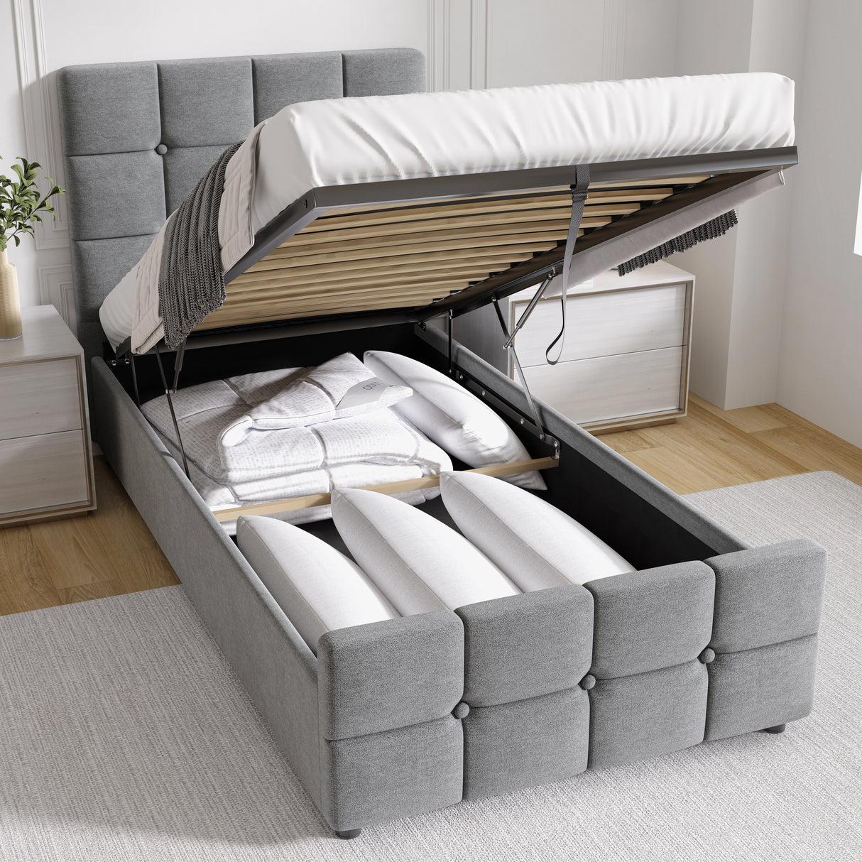 Square Ottoman Storage Bed in grey velvet with gas lift mechanism open, revealing under-bed storage with pillows and bedding inside.