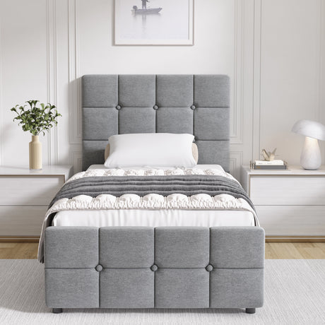 Gray upholstered bed in a bedroom setting with white walls and decor.