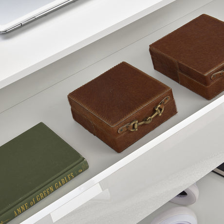 High Gloss Lift Top Coffee Table With Hidden Storage Shelf featuring interior storage with brown leather boxes and a green book. Ideal for modern UK living rooms.