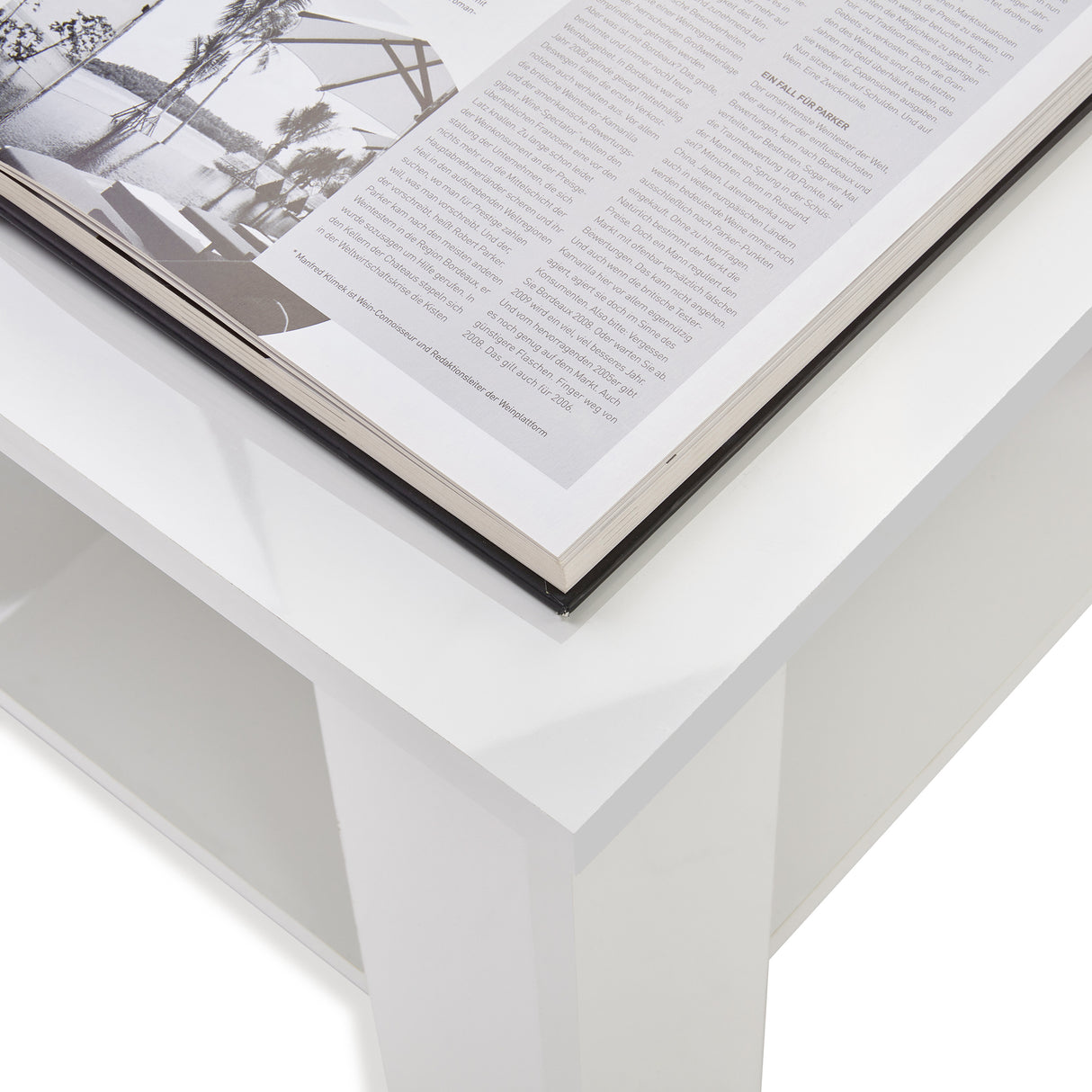 High gloss lift top coffee table with hidden storage shelf in white finish, featuring a modern design and open lower shelf for extra storage.