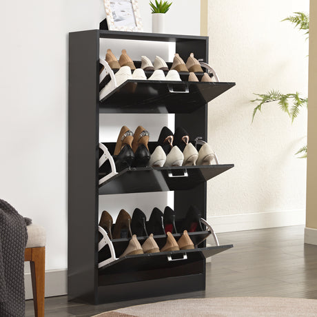 All three drawers of this tall shoe cabinet are pulled down, neatly housing up to 18 pairs of shoes.