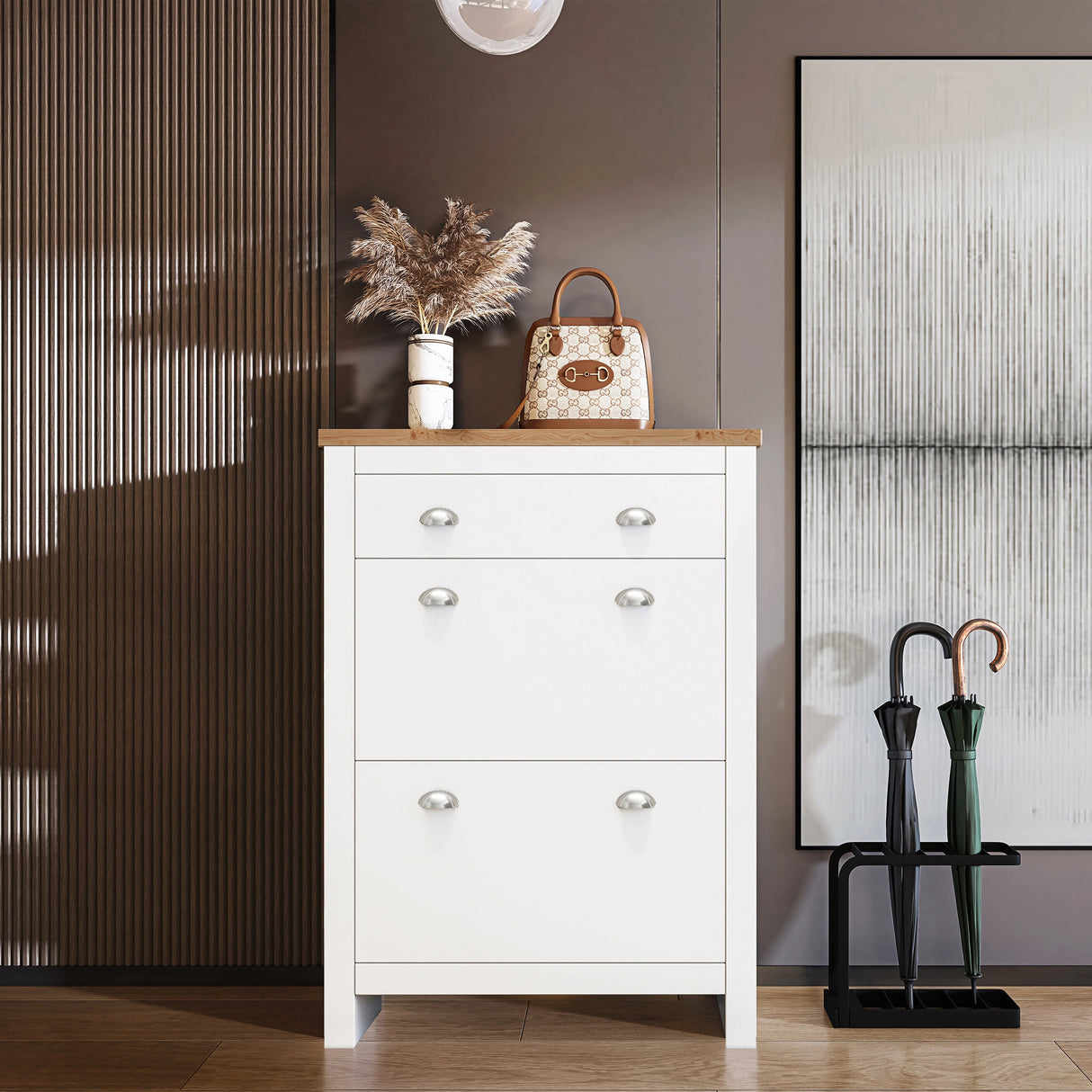 small shoe cabinet in white with oak top, two pull‑down doors and top drawer, bag and decor displayed on wooden surface