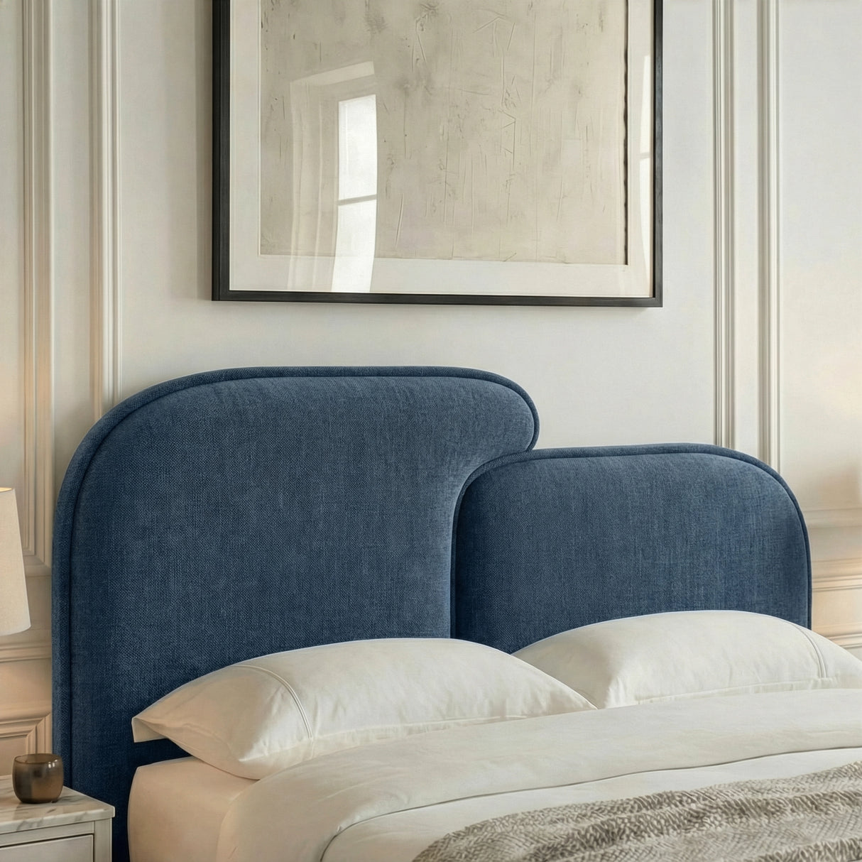 Close detail of split padded headboard sections showing rounded corners and stitched fabric surface