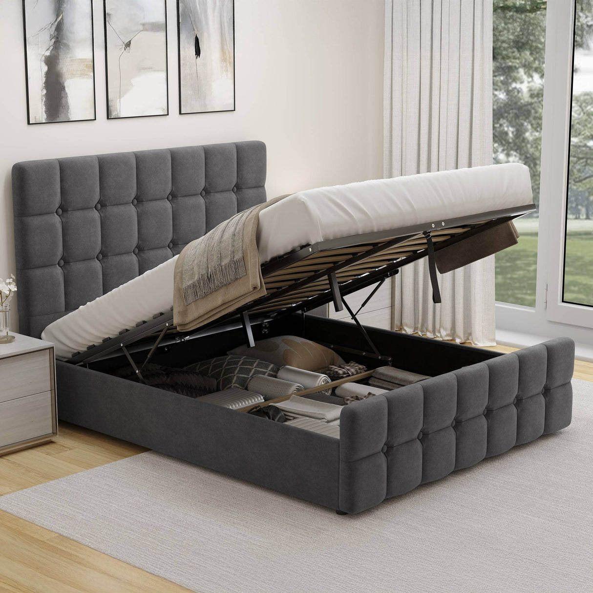 Dark grey velvet Ottoman Bed Frame in small double size with lifted mattress, revealing spacious underbed storage compartment.