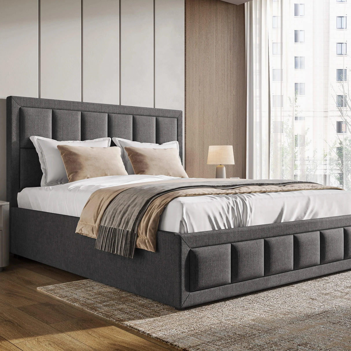 Gray upholstered bed with white bedding and beige pillows in a modern bedroom.