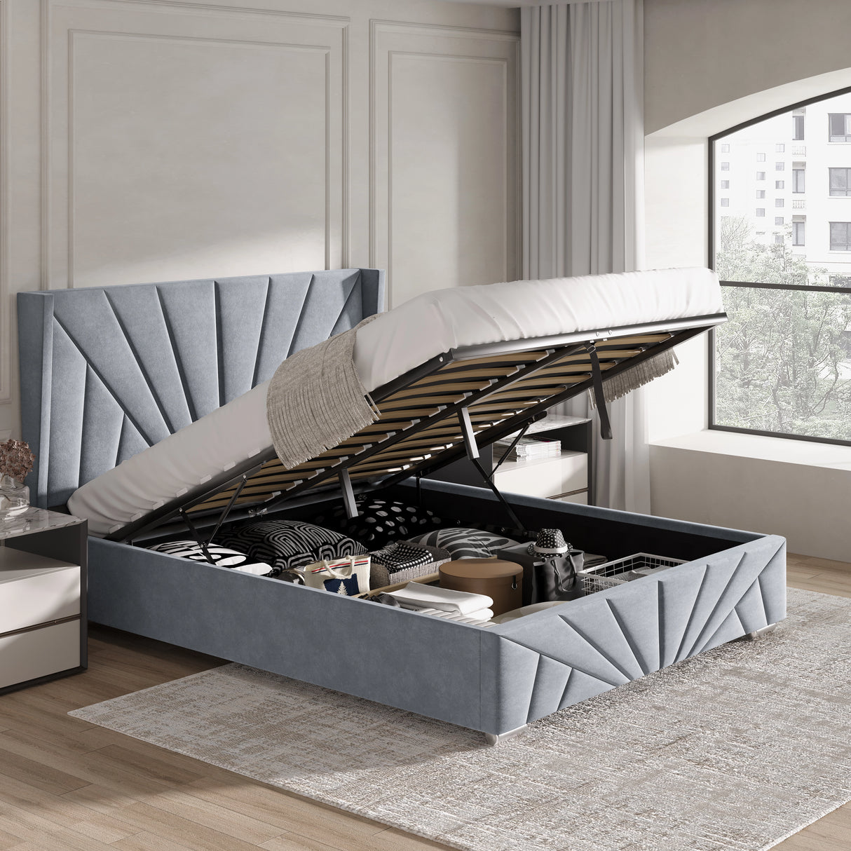 Small double Sunrise Ottoman Bed Frame in grey velvet with lifted mattress, showcasing spacious underbed storage compartments.