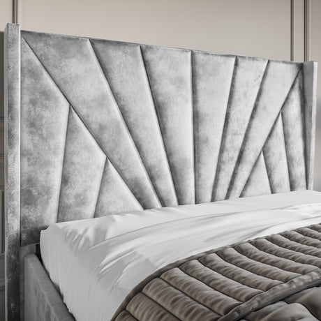 Crushed Velvet Ottoman Storage Bed Silver with Sunrise Bed Frame featuring a tall, winged headboard and vertical panel design. Ideal for modern bedrooms.