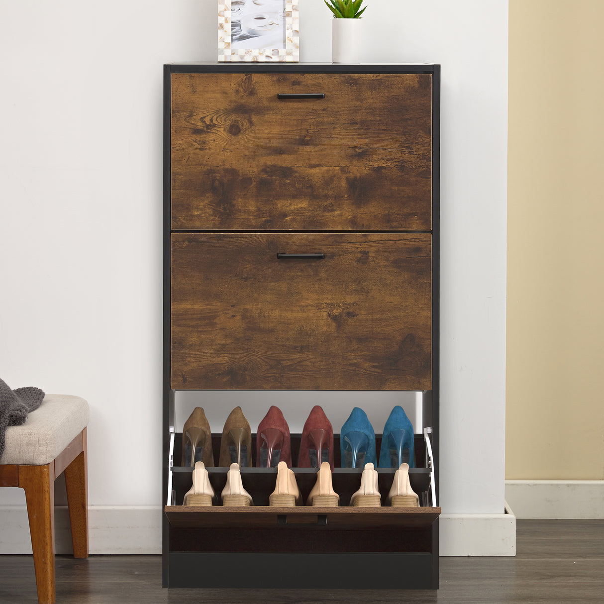 Slim shoe cabinet with doors slightly open, revealing 6 shoes in the bottom pull-down drawer.