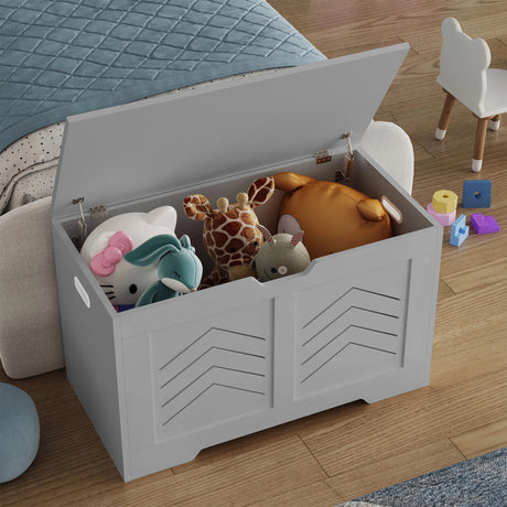 Gray toy storage box filled with stuffed animals on a wooden floor.