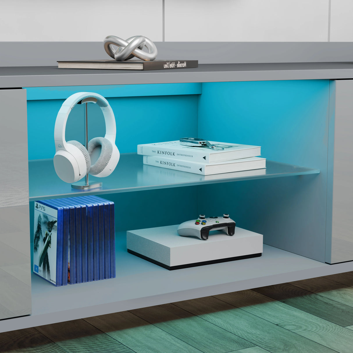 Modern shelf with headphones, books, and a game console on a blue and gray background