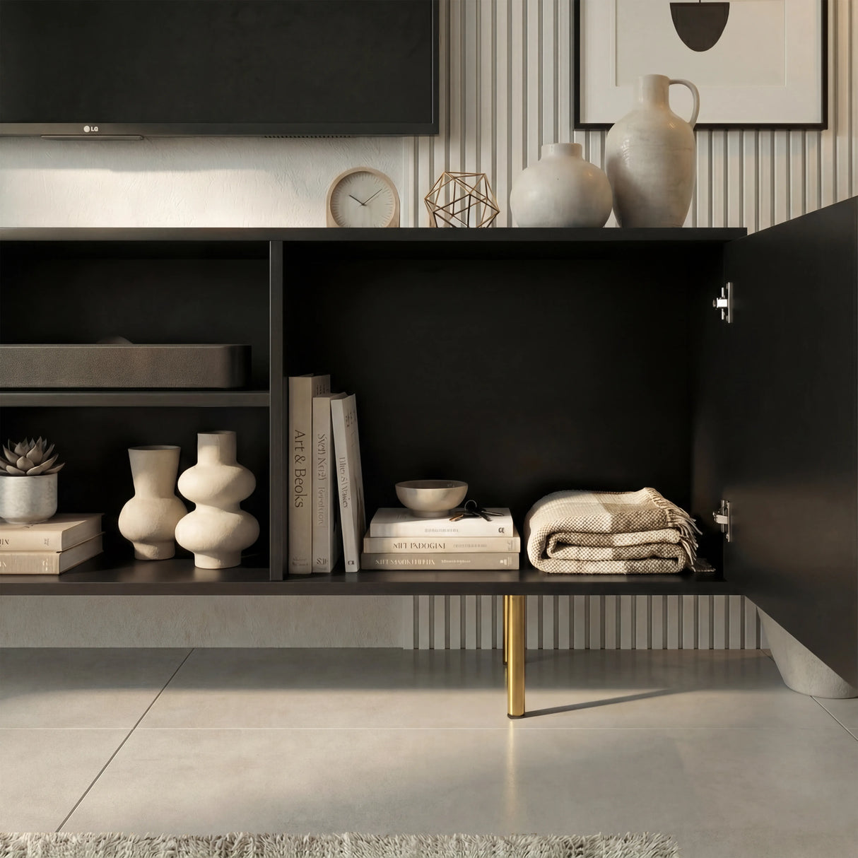 Black TV entertainment unit with open shelving and fluted doors, showcasing interior storage for media devices.