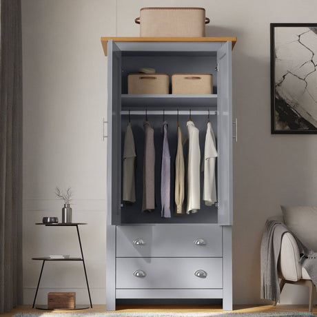 Two door wardrobe with drawers, offering spacious storage for clothes and accessories.