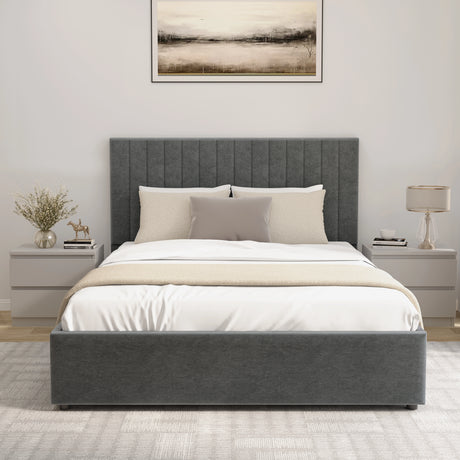 Gray upholstered bed with white bedding in a bedroom setting.