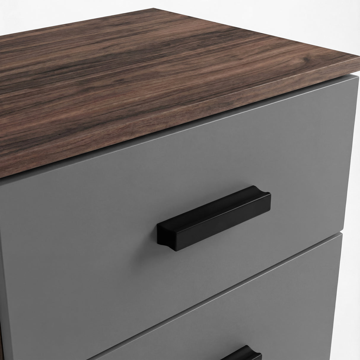 Close up of walnut top surface and black handle mounted on grey two drawer bedside table