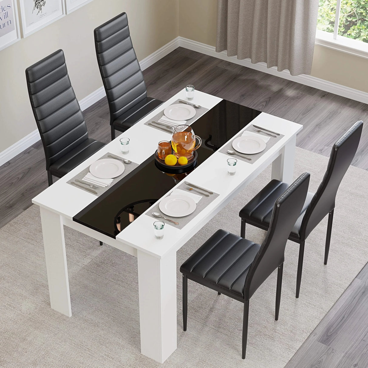 top-down view of white table and chairs featuring gloss black stripe and black upholstered seats