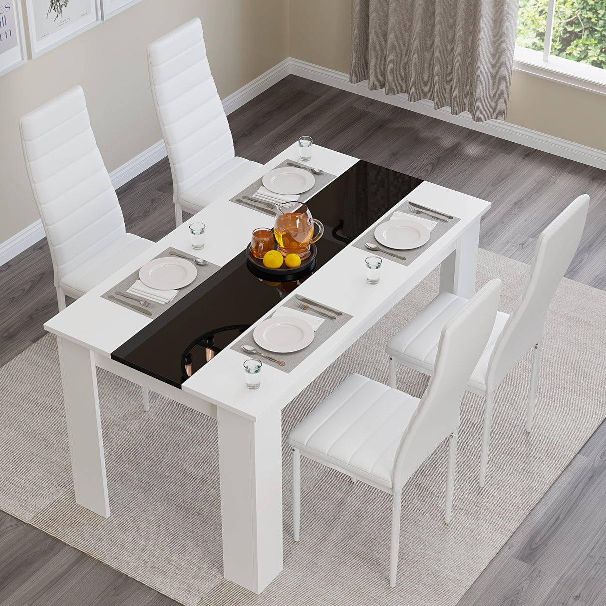 top to bottom view of small dining table set for 4 with white gloss and black striped table and white chairs arranged neatly