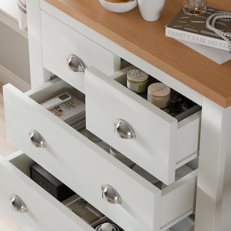 Close-up of 4 drawer chest from 2 Door Wardrobe With Drawers and 4 Drawer Chest - Bedroom Set in white, featuring silver handles and wood top finish.