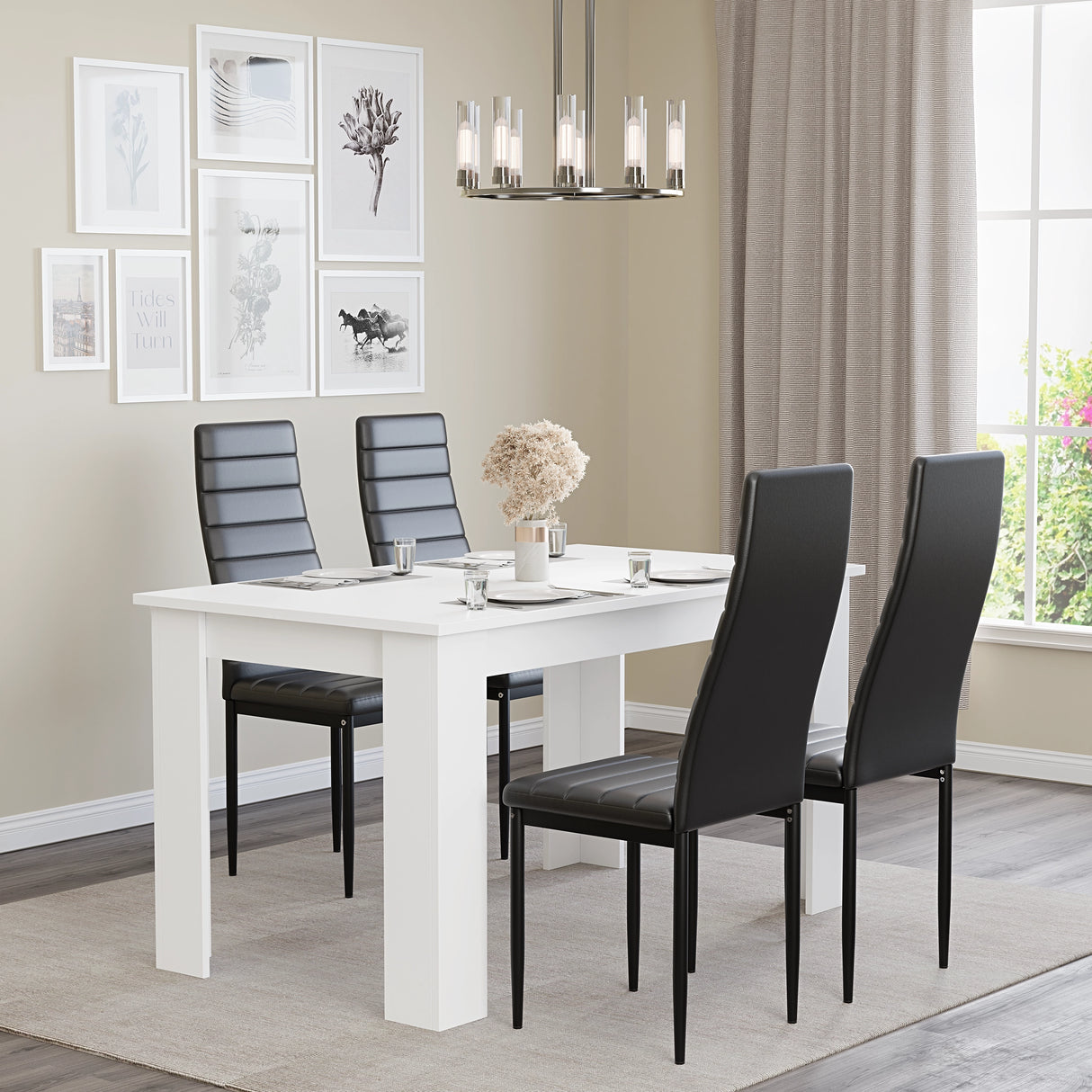White dining table set for 4 with black leather chairs, styled in a modern dining room with wall art and chandelier. Perfect for small families.