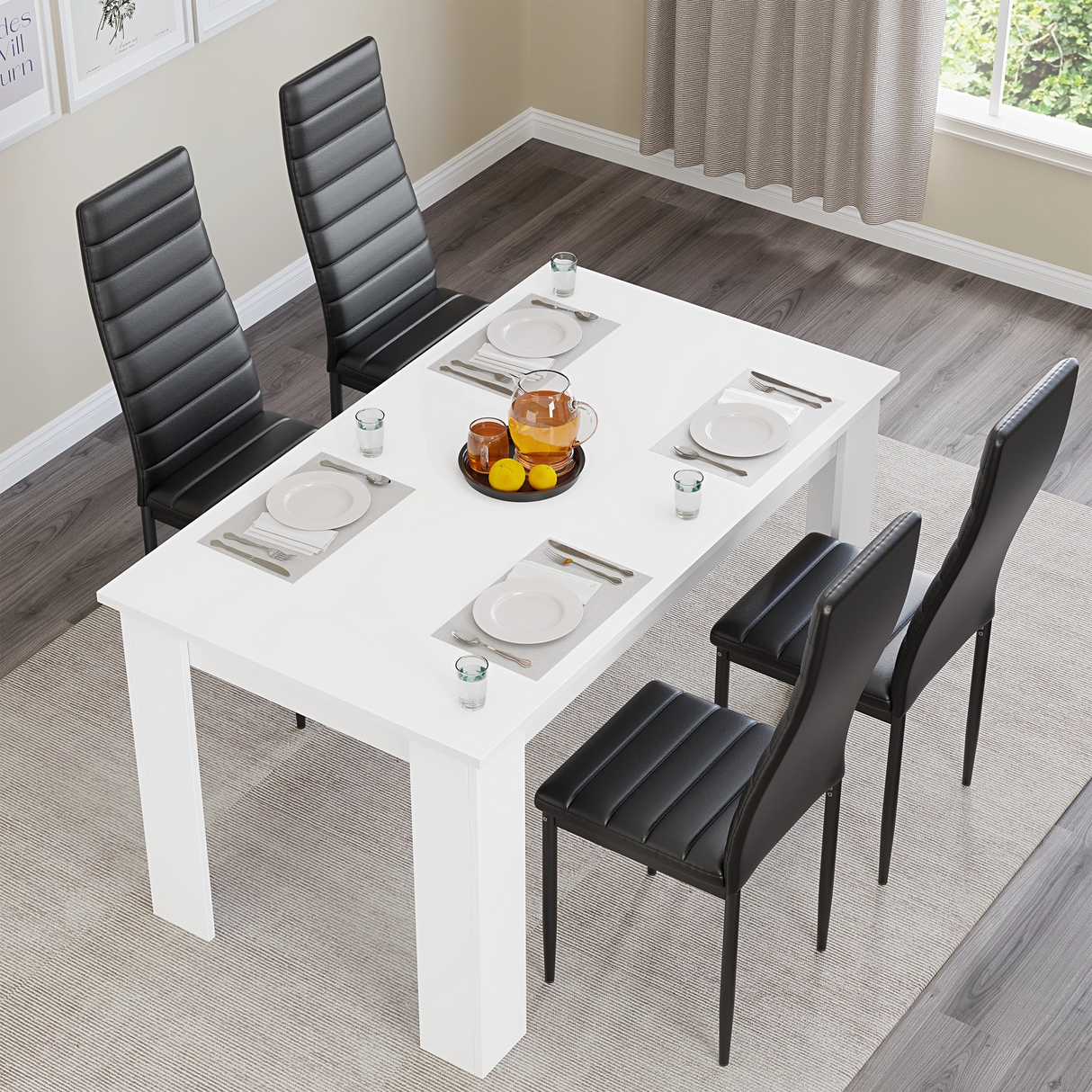 Top view of modern white dining table set with black chairs, set for four. Ideal for stylish kitchen or dining room interiors.