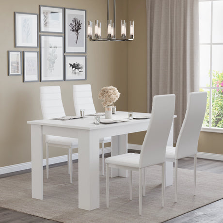 Modern 4-seater white dining table and chairs set with white leather chairs in a neutral-toned dining room. Elegant and space-saving.