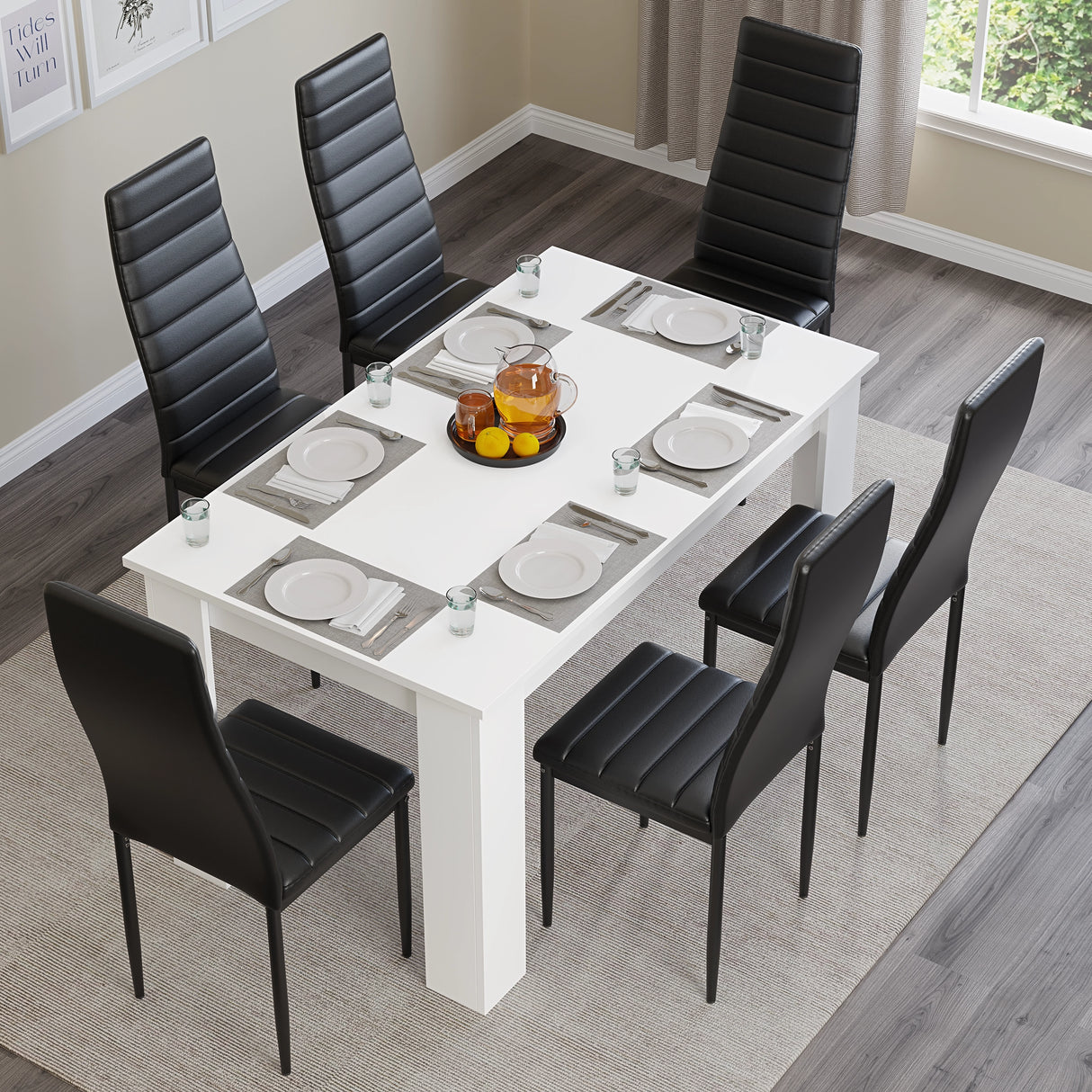 Top view of 6-seater white dining table with black chairs, set for a full meal. Perfect for modern dining rooms or kitchens.