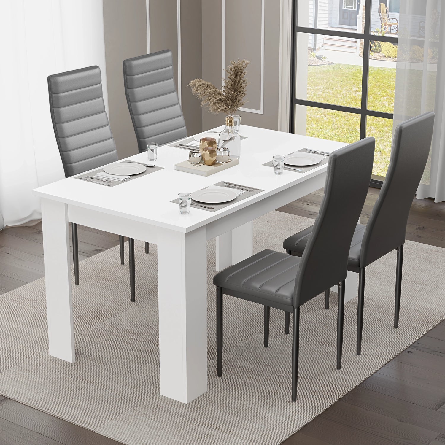 Sleek side view of a white dining table with black chairs, set for four — a refined choice for modern dining or kitchen spaces