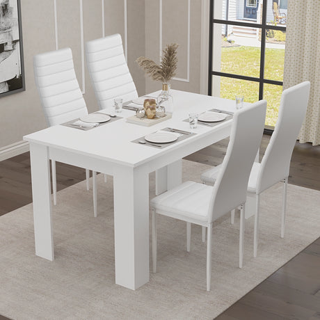 Chic side view of a four-seater white dining table set with white chairs — a perfect addition to any stylish, modern home.
