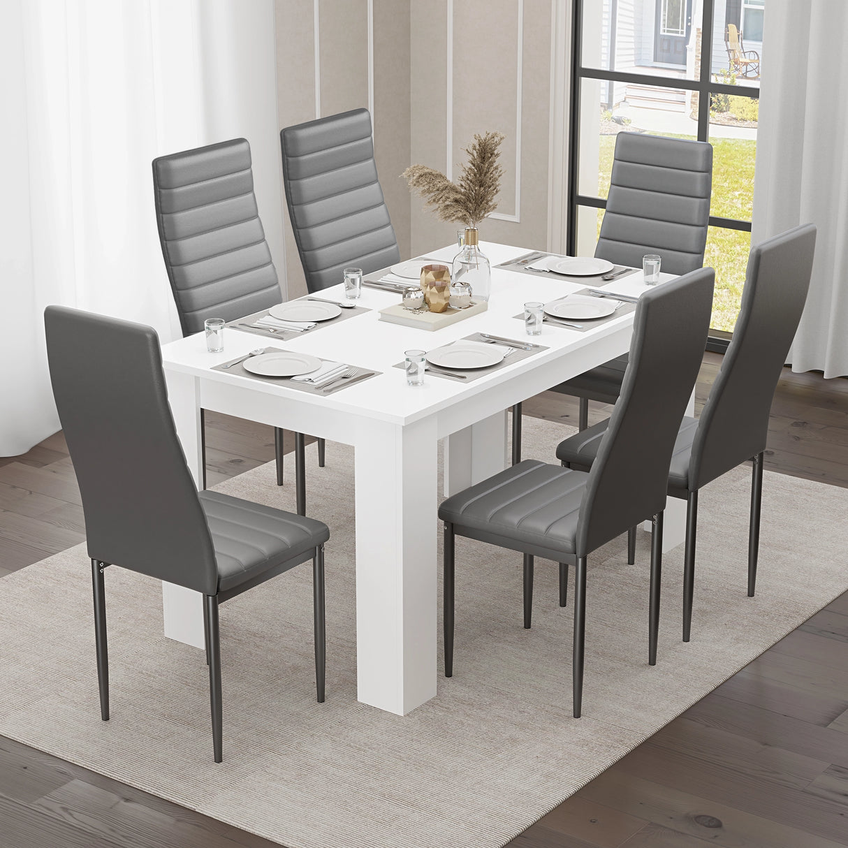 Modern white dining table paired with six grey chairs, creating a stylish and functional space for family dining."